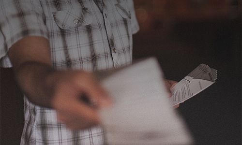Student passing out school spirit wear flyer